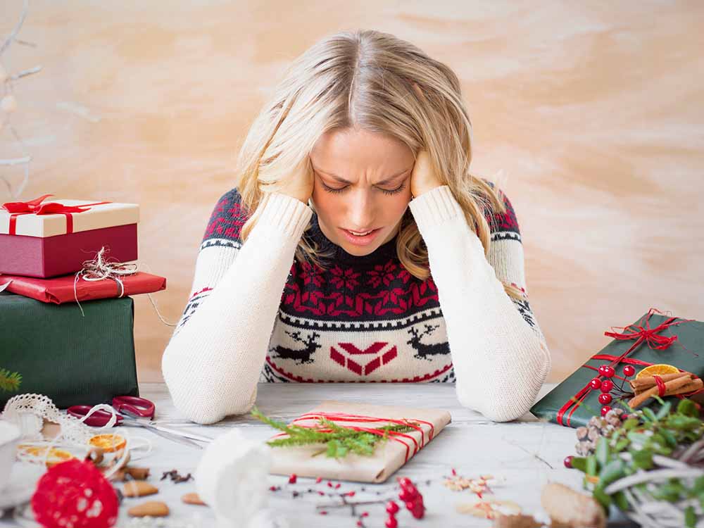 Woman stressed from gift giving holiday